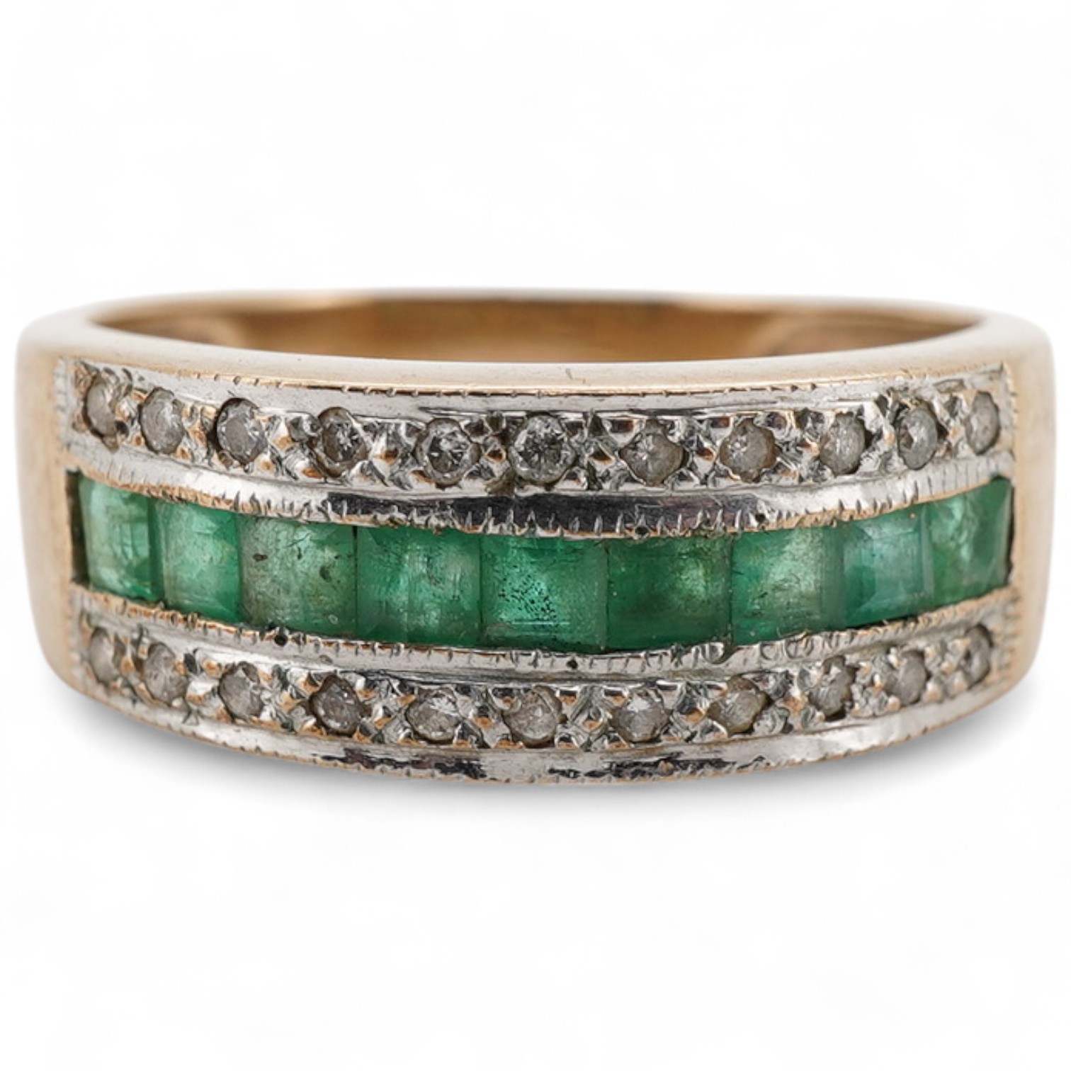 An emerald and diamond half hoop ring, channel-set to the front with calibré-cut emeralds, between lines of brilliant-cut diamonds, mounted in gold, size J, gross weight approximately 2.5 grams
